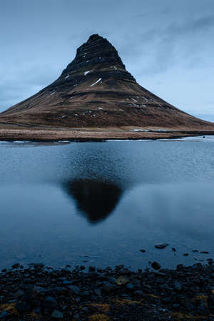 reflection of the mountain Kirkjufell on the surface of the lakeの写真素材