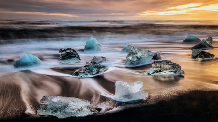 ice floes on the black sea sand and the coast