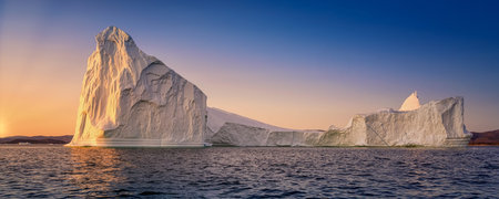 floating glaciers in the rays of the setting sun at polar night