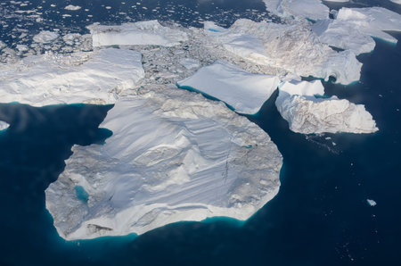 floating glaciers in the rays of the setting sun at polar night