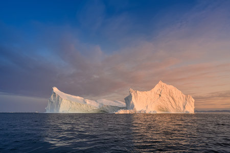 floating glaciers in the rays of the setting sun at polar nightの写真素材