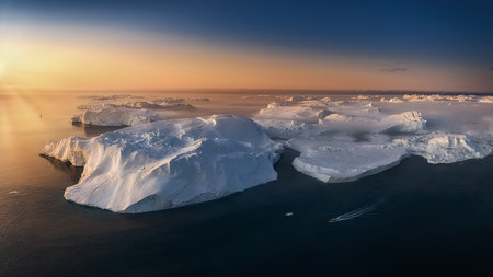 floating glaciers in the rays of the setting sun during a polar night