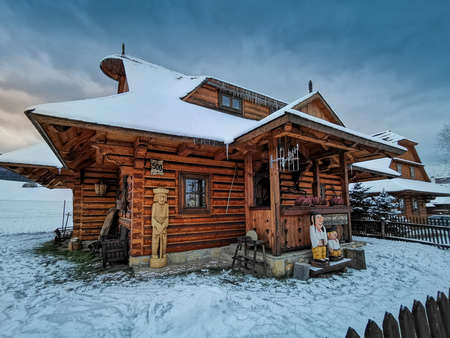 stylish wooden cottage for a holiday in the evening lightの写真素材