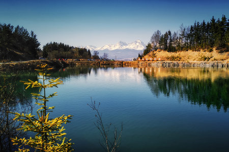 calm water level on the lake below the Tatras