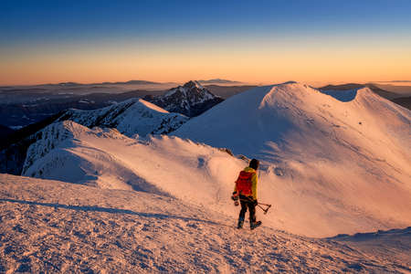 view of Chleb in Mala Fatra on snowy slopes with a ski alpinistの写真素材