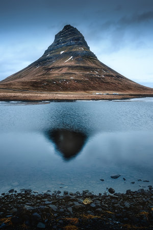 reflection of the mountain Kirkjufell on the surface of the lakeの写真素材