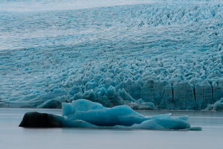 ice floes on the black sea sand and the coast Fjallsarlon lagoonの写真素材