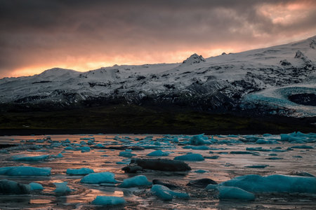 ice floes on the black sea sand and the coast Fjallsarlon lagoon