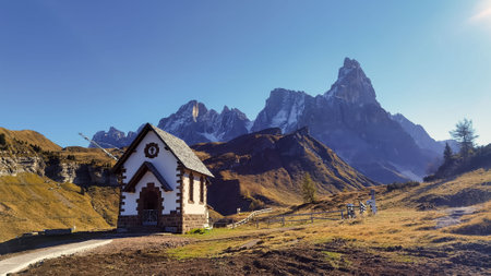 Cimon delle Pala mountain above Passo Rolle with white cloudsの写真素材