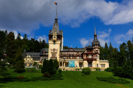 a view of the Neo-Gothic Romanian castle of Peles in autumnの写真素材