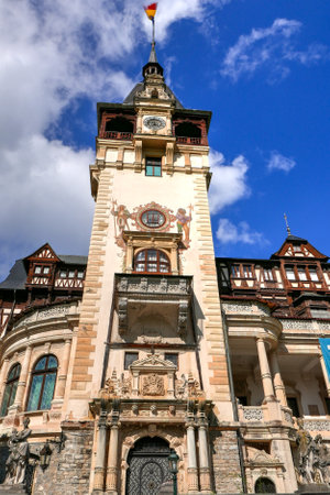 a view of the Neo-Gothic Romanian castle of Peles in autumnの写真素材