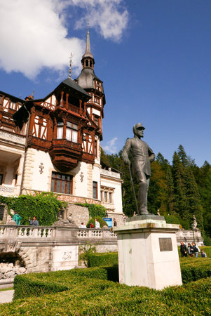 a view of the fairy-tale Neo-Gothic Romanian castle of Peles in autumnの写真素材