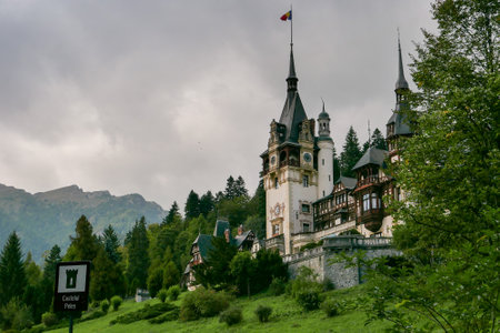 a view of the Neo-Gothic Romanian castle of Peles in autumnの写真素材
