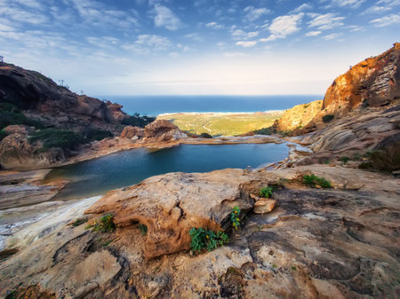 small lake on the Homhill plateau at sunsetの写真素材