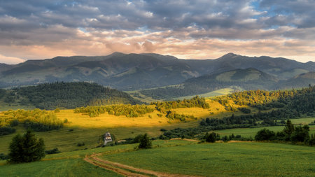 sunset over the village of Zuberec in the West Tatras in Slovakiaの写真素材
