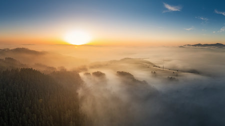 fog at sunrise near the village of Chmelnica near Stara Lubovna in Slovakiaの写真素材