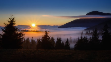 fog over the Liptov village of Velke Borove before sunrise by Liptovska Mara in Slovakiaの写真素材