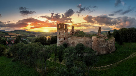 Sunset at the ruins of Plavec Castle above the Poprad River in northern Slovakiaの写真素材