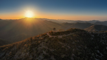 view from the mountain at the setting sun