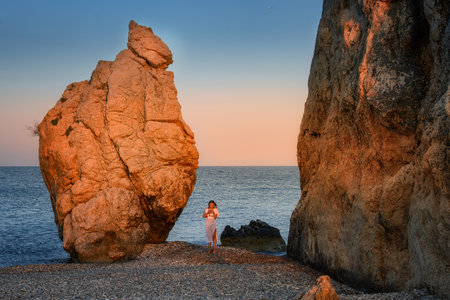 Rocks at Petra tou Romiou at sunset in Cyprusの写真素材