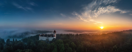 Konopiste Castle in the Benesov district of Central Bohemia, the last residence of Franz Ferdinand d'Este, heir to the Austro-Hungarian throne, view of Konopiste Castle at sunrise in the fogの写真素材
