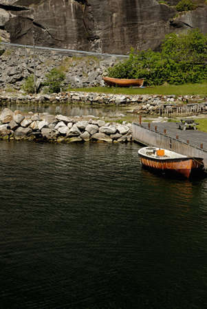 Picture of boat in dock in Lysefjord - fjord near Stavanger in Norway.の写真素材