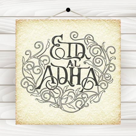 Islamic calligraphy with abstract decor of text Eid-Ul-Adha on wood table background for Muslim festival celebrations. Template for greeting cardのイラスト素材