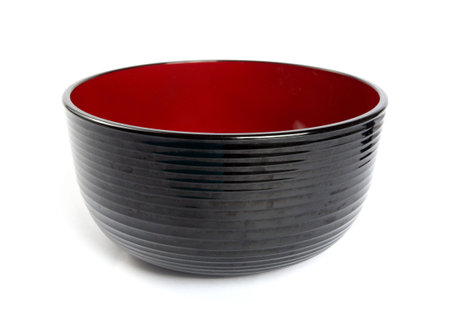 Black color empty bowl isolated on whiteの写真素材