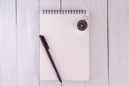 note book,pen,compass on the desk.top viewの写真素材