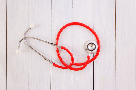 Stethoscope,on wooden desk as medical conceptの写真素材