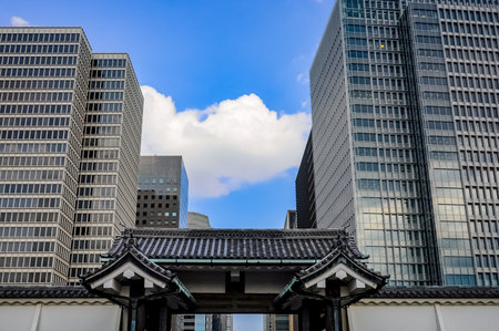 Tokyo, Japan - Entrance from the backside of the emperial palace with some big buidings on the backgroundのeditorial素材