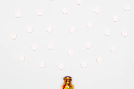 Pharmaceutical and health concept, Tablets floating out from brown glass bottle.の写真素材