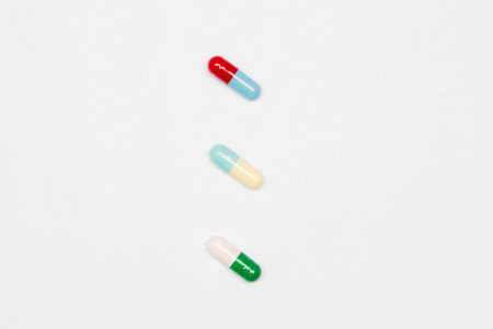 Pharmaceutical and health concept, Antibiotic capsule is arranged in row on white background.の写真素材