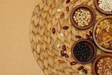 Flat lay of healthy grains concept, Various bean in wooden bowl on brown background.の写真素材