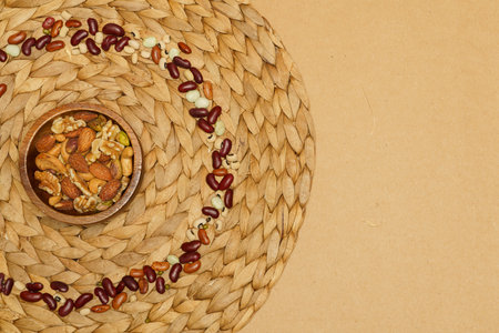 Flat lay of healthy grain concept, Nut with almond in wooden bowl and beans are arranged in circles.の写真素材