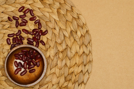 Flat lay of healthy grains concept, Red bean in wooden bowl on brown background.の写真素材