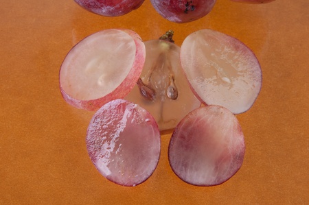 Purple grapes on a brown backgroundの写真素材