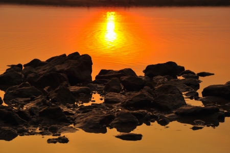 Stones on the beach in the evening の写真素材