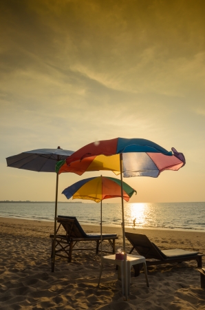 Beach chair and umbrella in the eveningの写真素材