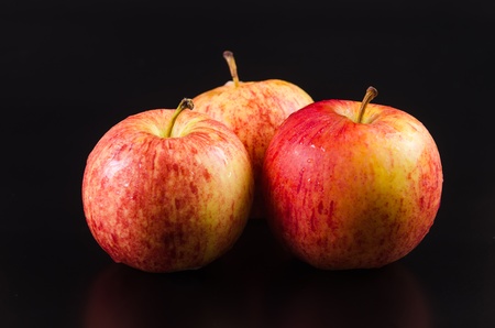 fresh apples on a black backgroundの写真素材