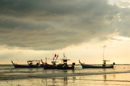 Fishing boat at the beachの写真素材