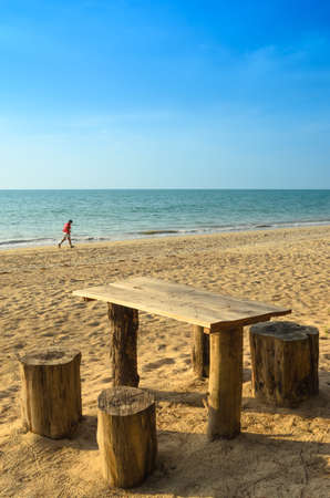 Tables and seats at the beachの写真素材