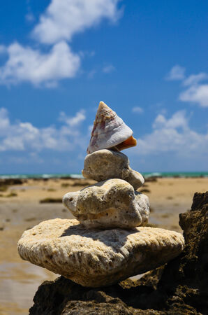 Beach rocks and the sky and cloudsの写真素材