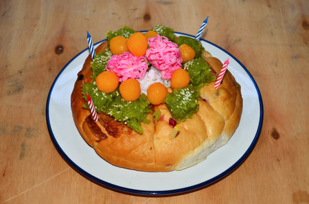 Cake and candles on a plateの写真素材