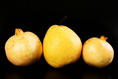 Fresh group oriental pear and pomegranate on black backgroundの写真素材