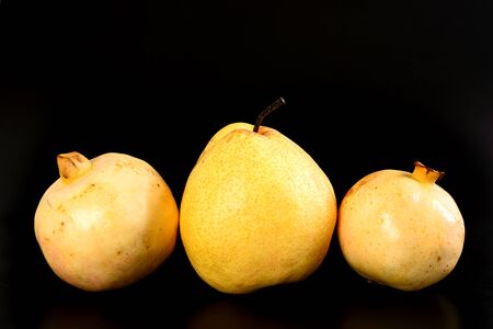 Fresh group oriental pear and pomegranate on black backgroundの写真素材
