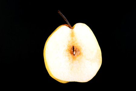 fresh nashi pear and  cut on black backgroundの写真素材