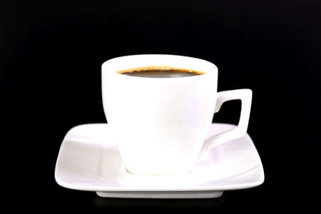 Coffee cup and saucer on black backgroundの写真素材