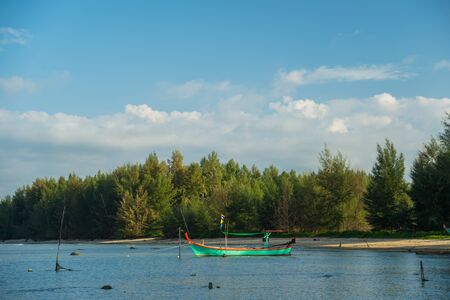 Fishing boats head out to seaの写真素材