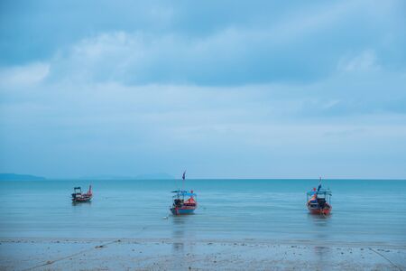 Fishing boats and cloud sky at sea Thailandの写真素材